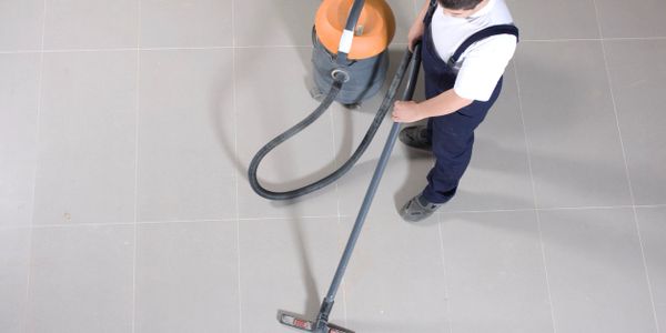 Overhead view of floor cleaning worker